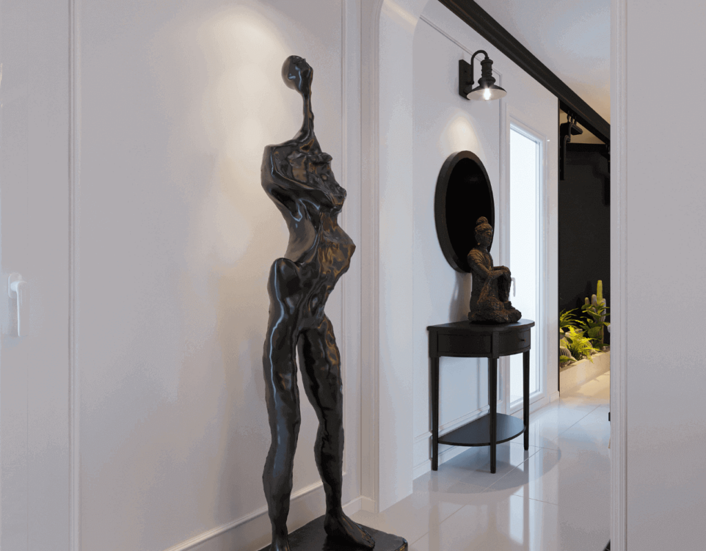 A uniqye piece of black sculpture in human figure design in white background