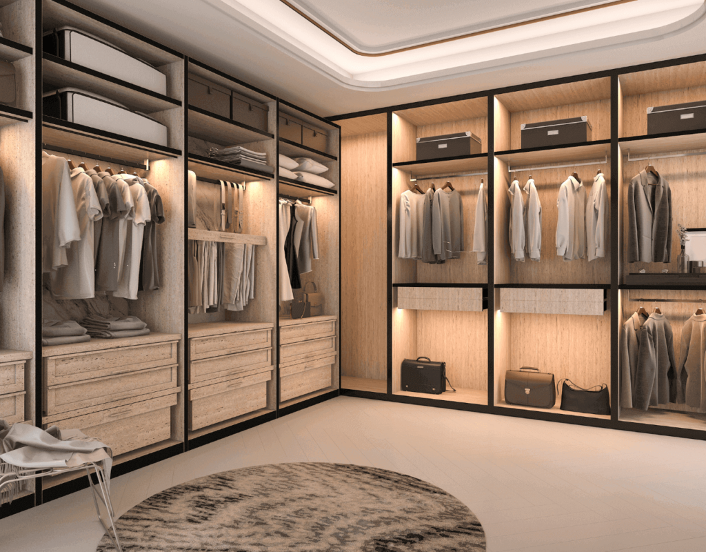 A customized walk in closet with mirror doors and hanged clothes