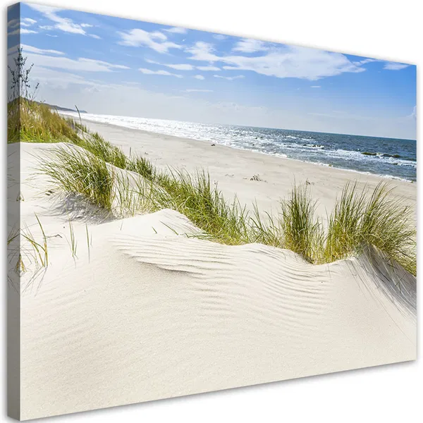 Serene beach landscape with rolling sand dunes, beach grass, and the ocean under a clear blue sky