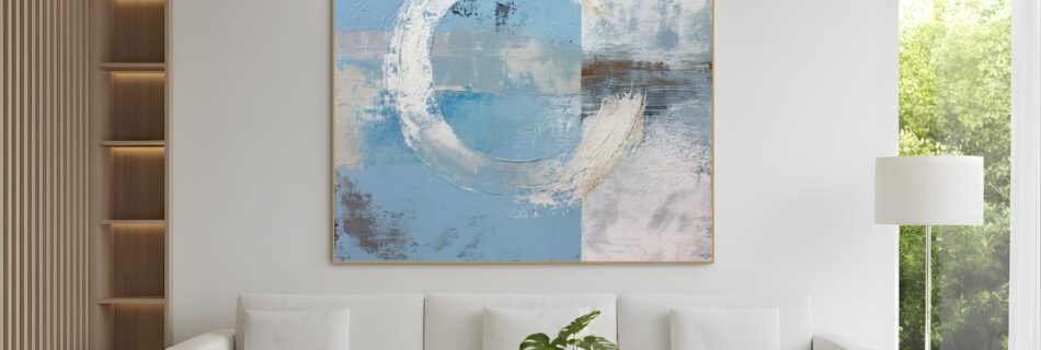 Abstract blue and white circular painting above sofa – A contemporary living room with a white sofa and a square abstract painting in soft blues and whites, featuring circular shapes, above the sofa.