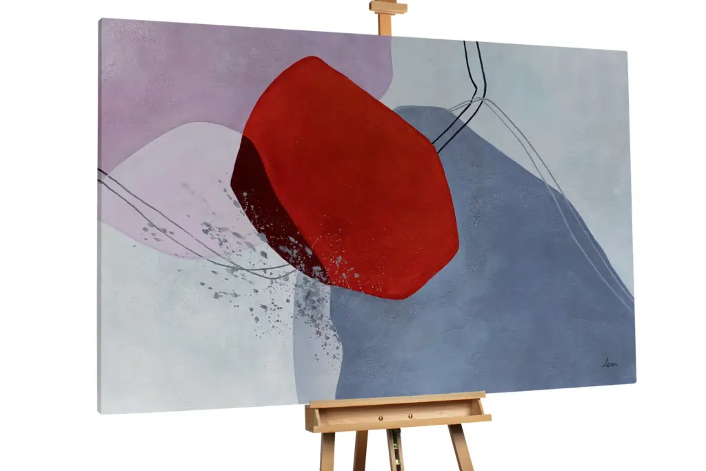 An abstract painting on a wooden easel featuring a large, bold red geometric shape set against a background of muted lavender and slate blue washes with delicate line details.