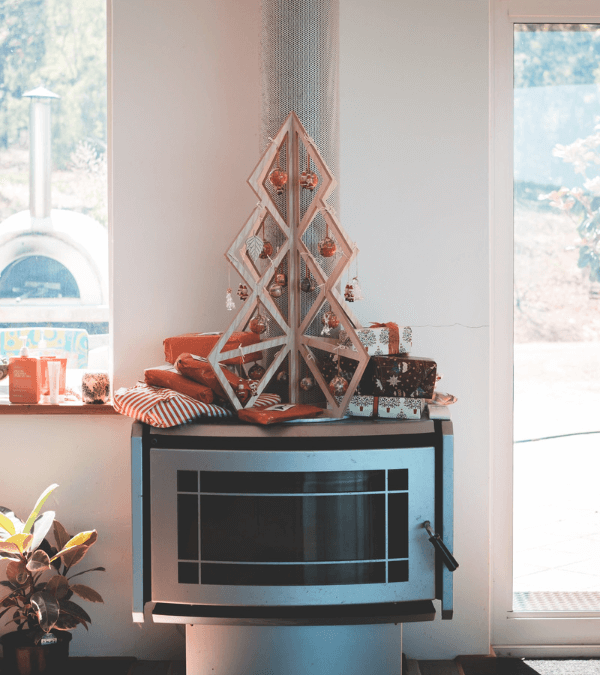 A wooden Christmas tree with decorative Christmas balls